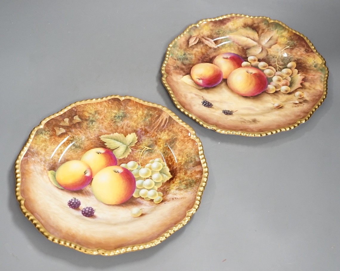 A pair of Royal Worcester fruit painted dinner plates, post war, by D. Shinnie and T. Nutt, 27cm diameter